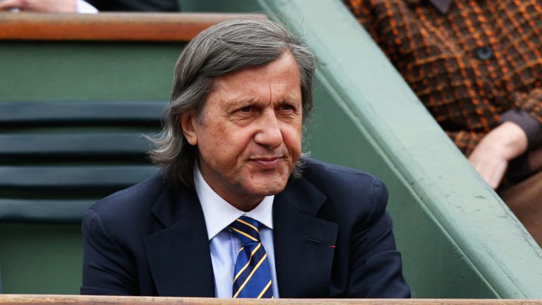 Former tennis player Ilie Nastase watches the action during Women's Singles match at the French Open