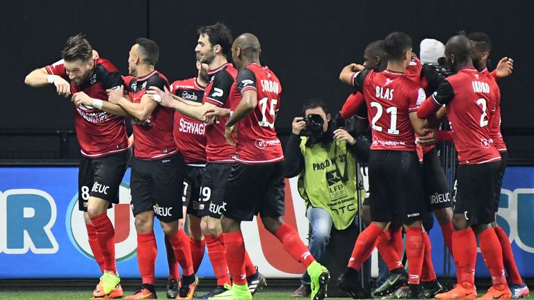 Guincamp's French midfielder Lucas Deaux (1st-L) is congratulated by his teammates after scoring during the French L1 football match Guingamp against Basti