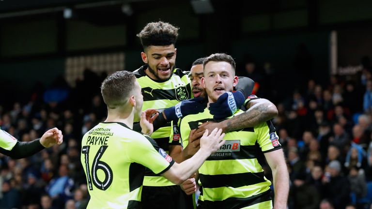 Huddersfield Town's Harry Bunn (right) celebrates scoring his side's first goal of the game with team-mates during the Emirates FA Cup, Quarter Final Repla