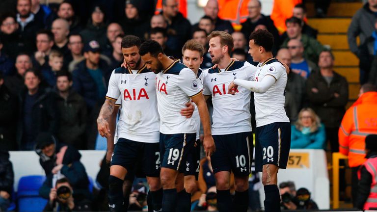 Tottenham Hotspur's English striker Harry Kane (2nd R) celebrates with teammates after scoring the opening goal of the English Premier League football matc