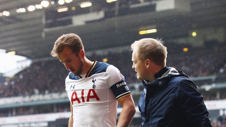 Harry Kane is taken off injured during The Emirates FA Cup Quarter-Final match between Tottenham and Millwall