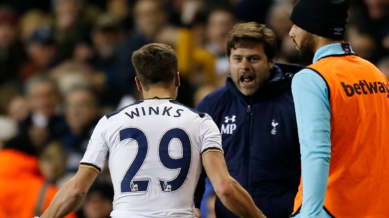 Harry Winks celebrates with Mauricio Pochettino after his goal against West Ham