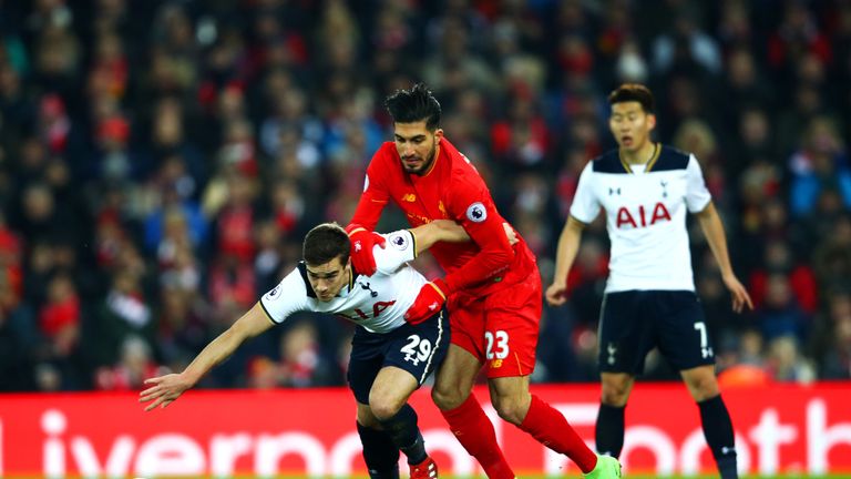Harry Winks vies for the ball with Liverpool's Emre Can