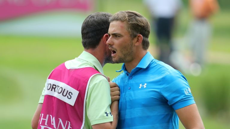 PRETORIA, SOUTH AFRICA - MARCH 02:  Haydn Porteous of South Africa speaks with his caddie after finishing his round on the 9th during Day One of The Tshwan