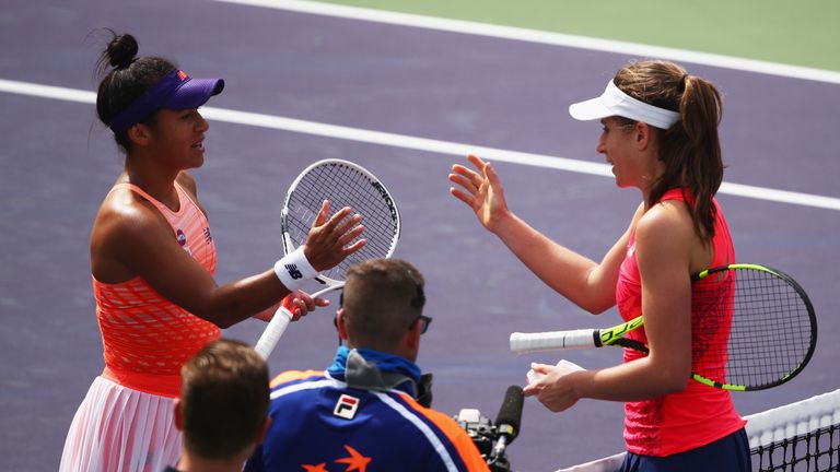 Johanna Konta shakes hands at the net after her straight sets victory against Heather Watson