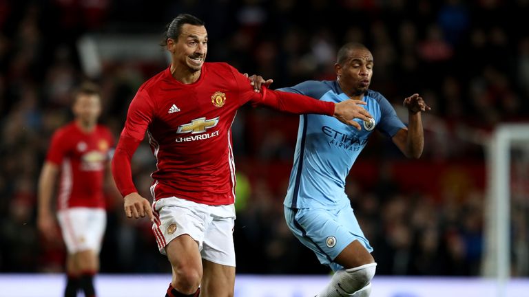 MANCHESTER, ENGLAND - OCTOBER 26:  Zlatan Ibrahimovic of Manchester United (L) and Fernando of Manchester City (R) battle for possession during the EFL Cup