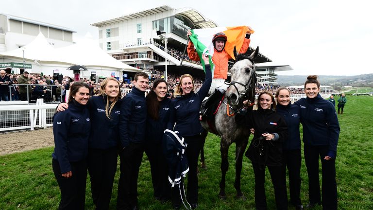 CHELTENHAM, UNITED KINGDOM - MARCH 14: Jack Kennedy on board Labaik (C) celebrates after winning the Sky Bet Supreme Novices Hurdle with stable staff durin
