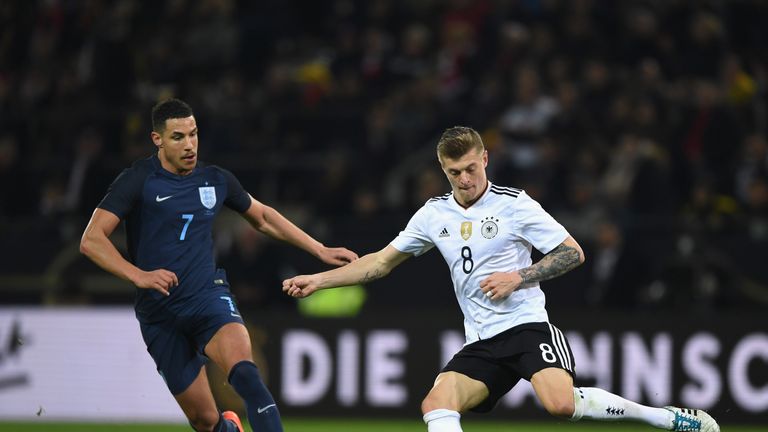 DORTMUND, GERMANY - MARCH 22: Toni Kroos of Germany (R) is put under pressure from Jake Livermore of England (L) during the international friendly match be