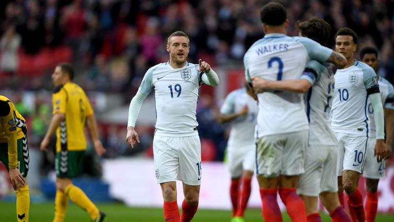 Jamie Vardy celebrates with his team-mates after scoring against Lithuania
