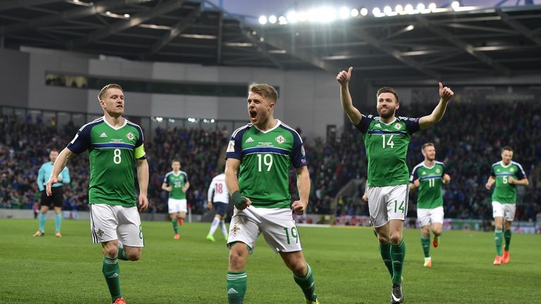 BELFAST, NORTHERN IRELAND - MARCH 26: Jamie Ward (C) of Northern Ireland celebrates scoring with team mates during the FIFA 2018 World Cup Qualifier betwee