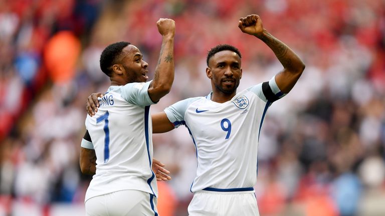 Jermain Defoe celebrates with Raheem Sterling after scoring on his return to the England side 