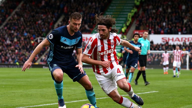 STOKE ON TRENT, ENGLAND - MARCH 04:  Joe Allen of Stoke City battles with Ben Gibson of Middlesbrough during the Premier League match between Stoke City an