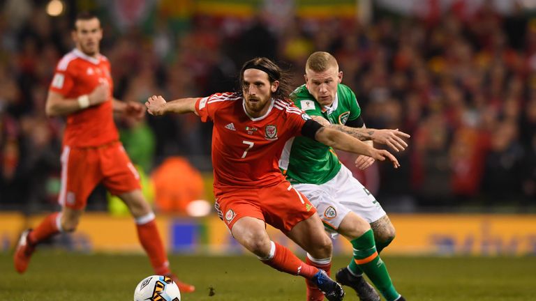 DUBLIN, IRELAND - MARCH 24:  Joe Allen of Wales evades James McClean of the Republic of Ireland during the FIFA 2018 World Cup Qualifier between Republic o