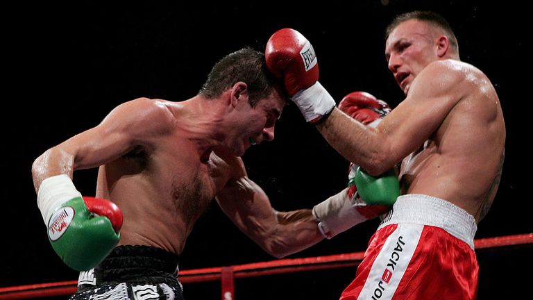 Joe Calzaghe (L) throws a punch at Mikkel Kessler during the super-middleweight title unification fight  on November 3, 2007