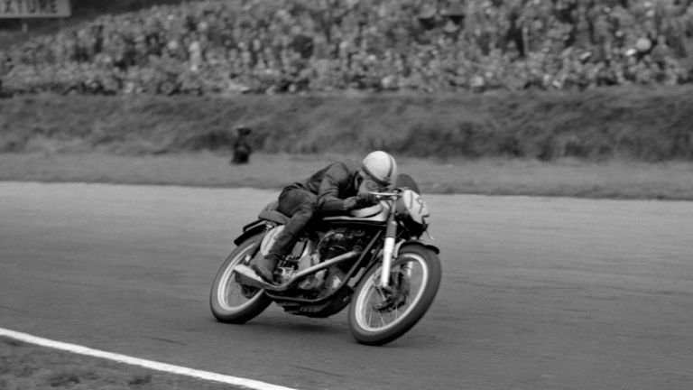 Brilliant youngster John Surtees streaks round Brands Hatch on his way to victory over World Motor Cycle champion Geoff Duke. Surtees, riding a Norton, tri