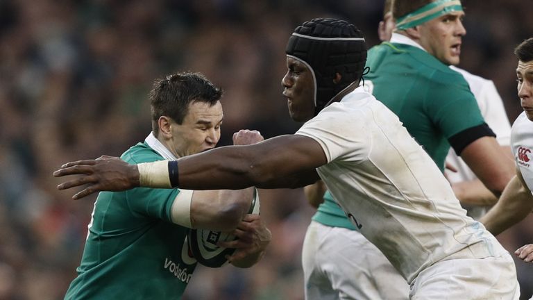 England flanker Maro Itoje (right) tackles Ireland's fly-half Johnny Sexton