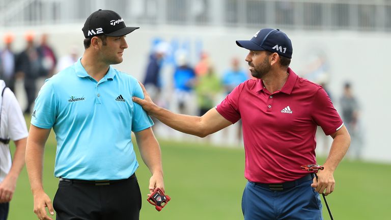 AUSTIN, TX - MARCH 24: Sergio Garcia (R) of Spain and Jon Rahm of Spain talk after putting on the 13th hole of their match during round three of the World 