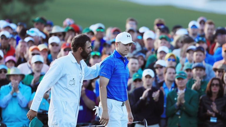 AUGUSTA, GA - APRIL 10:  Jordan Spieth walks with his caddie Michael Greller off the 18th green during the final round of the 2016 Masters Tournament at th