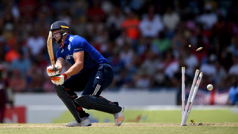 BRIDGETOWN, BARBADOS - MARCH 09:  Jos Buttler of England is bowled by Jason Holder of the West Indies during the 3rd One Day International between the West