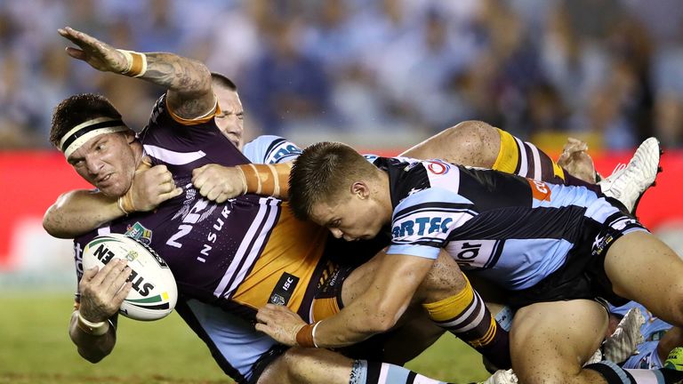 SYDNEY, AUSTRALIA - MARCH 02:  Josh McGuire of the Broncos is tackled during the round one NRL match between the Cronulla Sharks and the Brisbane Broncos a