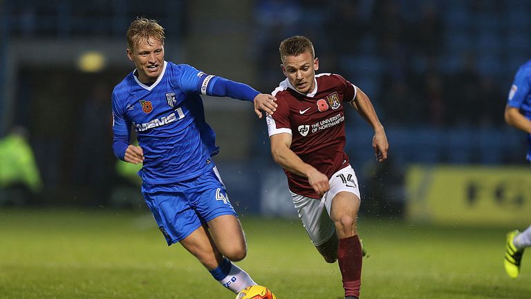 GILLINGHAM, UNITED KINGDOM - NOVEMBER 12:  Sam Hoskins of Northampton Town moves forward with the ball away from Josh Wright of Gillingham during the Sky B