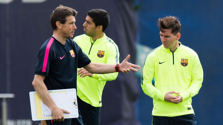 BARCELONA, SPAIN - MAY 05: Assistant coach Juan Carlos Unzue of FC Barcelona gives instructions to Lionel Messi during a training session ahead of their UE