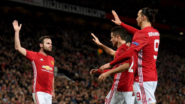 Juan Mata celebrates with his Manchester United team-mates 