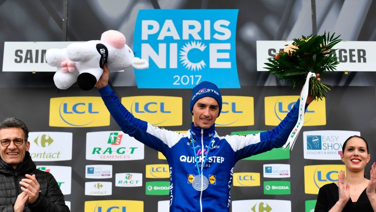 Stage winner France's Julian Alaphilippe celebrates on the podium after winning a 14,5 km individual time-trial, the fourth stage of the 75th edition of th