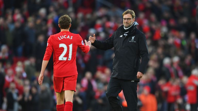 LIVERPOOL, ENGLAND - MARCH 12: Lucas Leiva of Liverpool (L) and Jurgen Klopp, Manager of Liverpool (R) embrace after the Premier League match between Liver