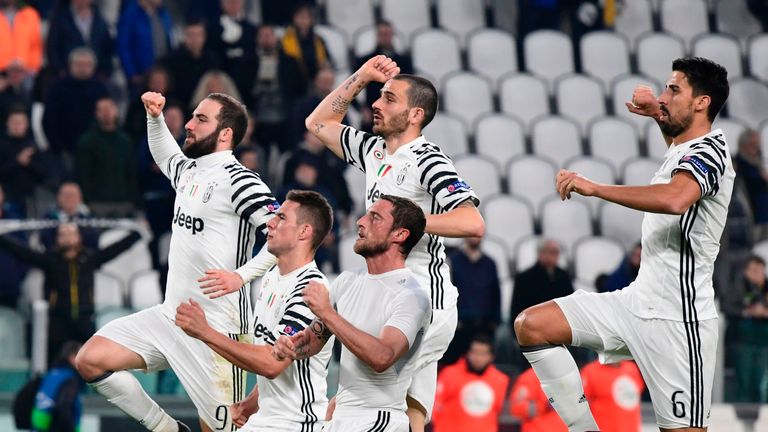Juventus players celebrate with supporters after winning the UEFA Champions League football match Juventus vs FC Porto on March 14, 2017 at the Juventus st