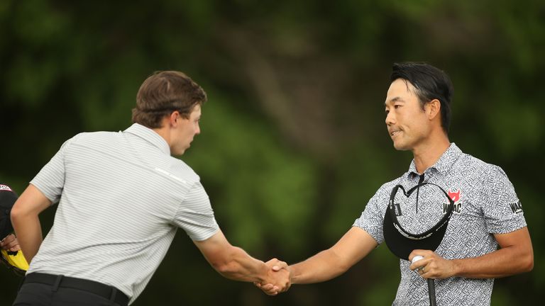 AUSTIN, TX - MARCH 24: Kevin Na (R) shakes hands with Matthew Fitzpatrick of England after winning their playoff on the 1st hole during round three of the 