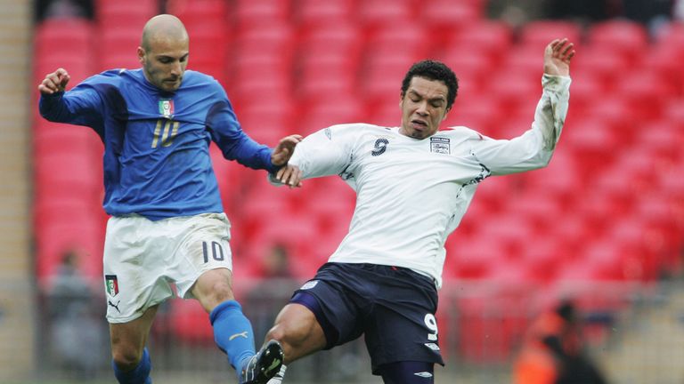 LONDON - MARCH 24:  Kieran Richardson of England tackles Alessandro Rosina of Italy during the U21 International Friendly match between England and Italy a