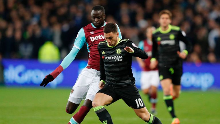 West Ham United's Senegalese midfielder Cheikhou Kouyate (L) vies with Chelsea's Belgian midfielder Eden Hazard during the English Premier League football 