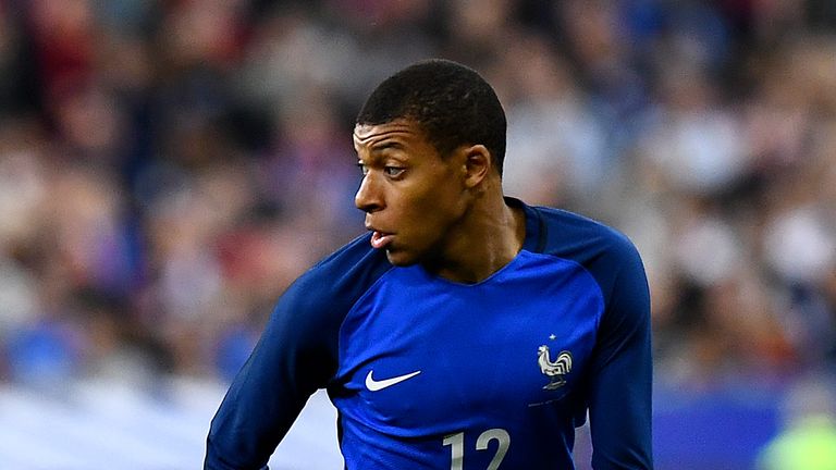 France's forward Kylian Mbappe Lottin  runs with the ball during the friendly football match France vs Spain on March 28, 2017 at the Stade de France