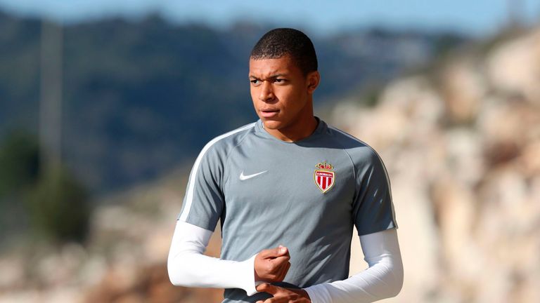 Monaco's French forward Kylian Mbappe Lottin arrives for a training session on the eve of their UEFA Champions League match v Manchester City