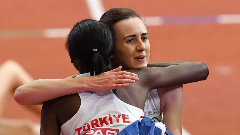 Britain's Laura Muir (back) hugs Turkey's second placed Yasemin Can after winning the women's 3000m final at the 2017 European Athletics Indoor Championshi