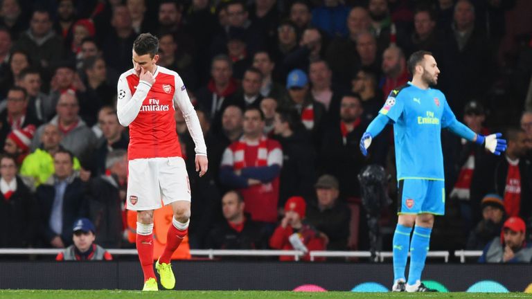 LONDON, ENGLAND - MARCH 07:  Laurent Koscielny of Arsenal looks dejected as he is sent off during the UEFA Champions League Round of 16 second leg match be