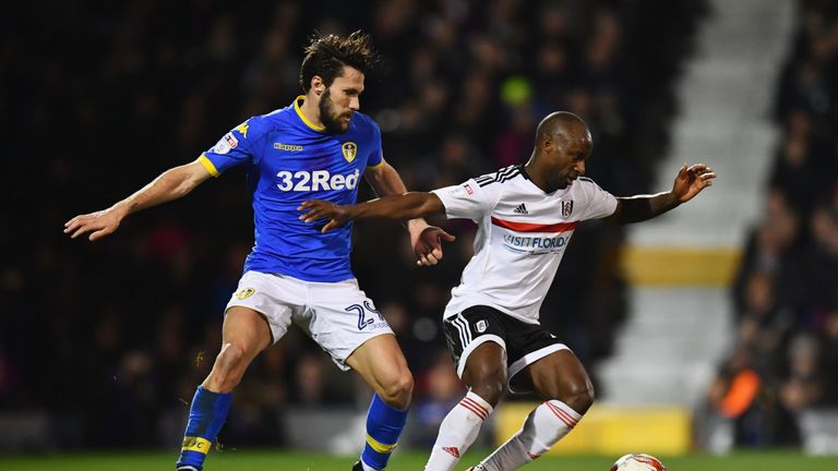 LONDON, ENGLAND - MARCH 07:  Sone Aluko of Fulham holds off Alfonso Pedraza of Leeds United during the Sky Bet Championship match between Fulham and Leeds 