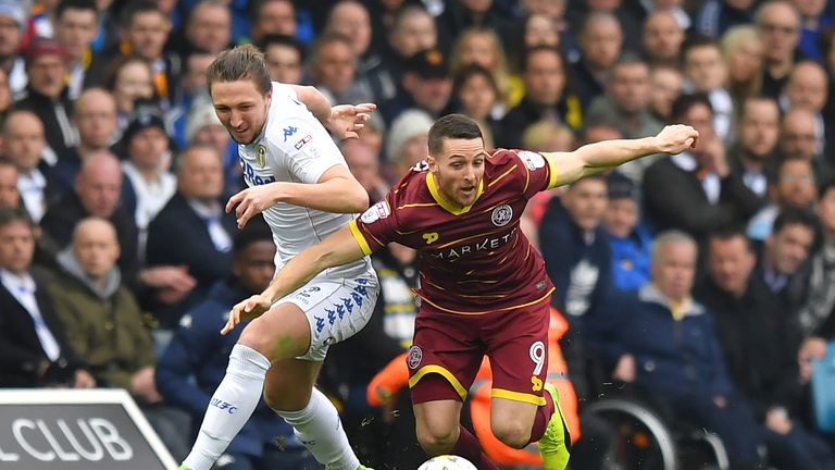 Queens Park Rangers' Conor Washington battles with Leeds United's Luke Ayling during the Sky Bet Championship match at Elland Road, Leeds.