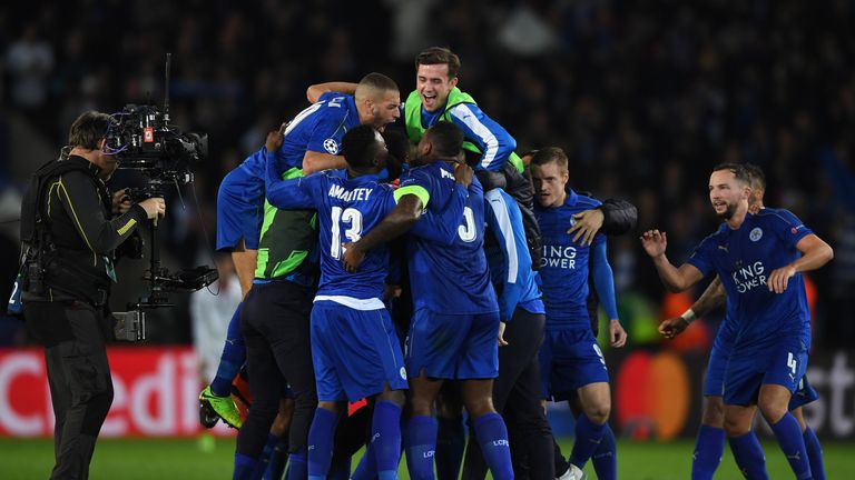 LEICESTER, ENGLAND - MARCH 14:  Leicester City players celebrate as the final whistle blows during the UEFA Champions League Round of 16, second leg match 