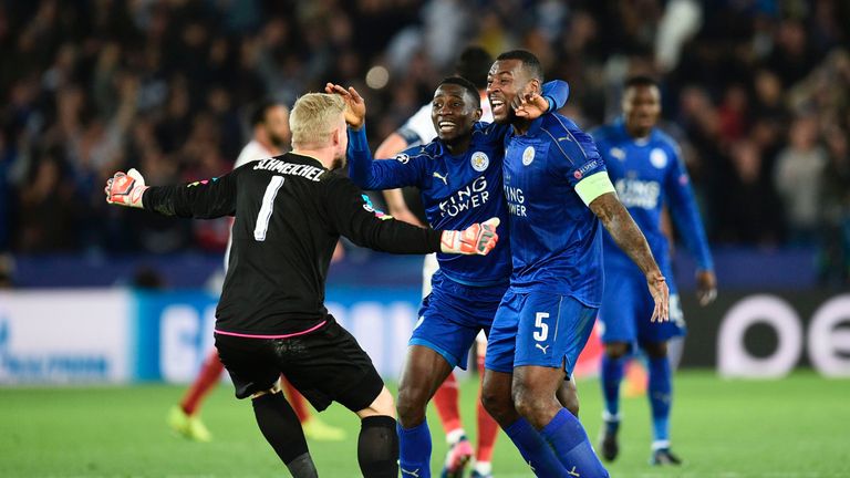 Leicester City's Nigerian midfielder Wilfred Ndidi (C), Leicester City's English-born Jamaican defender Wes Morgan (R) and Leicester City's Danish goalkeep