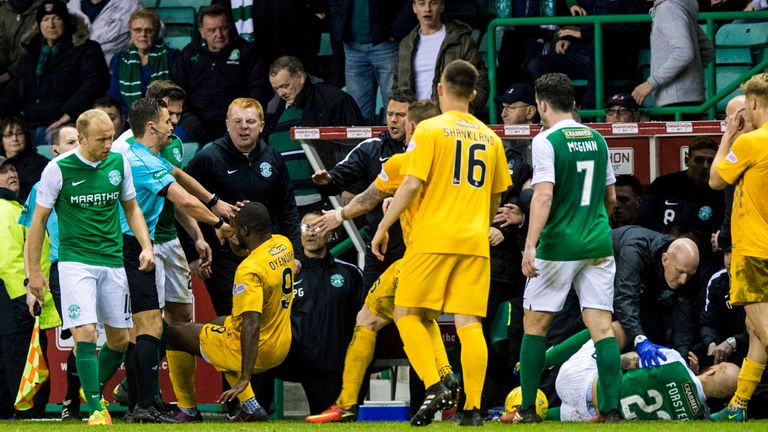 Oyenuga (9) is confronted by Lennon after his tackle on Hibernian's Jordan Forster 