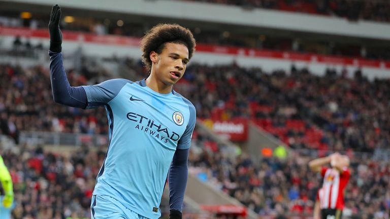 Manchester City's Leroy Sane (right) celebrates scoring his side's second goal during the Premier League match at the Stadium of Light, Sunderland.