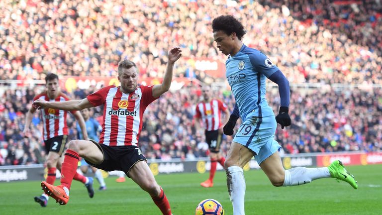 SUNDERLAND, ENGLAND - MARCH 05: Sebastian Larsson of Sunderland (L) attempts to stop Leroy Sane of Manchester City (R) during the Premier League match betw