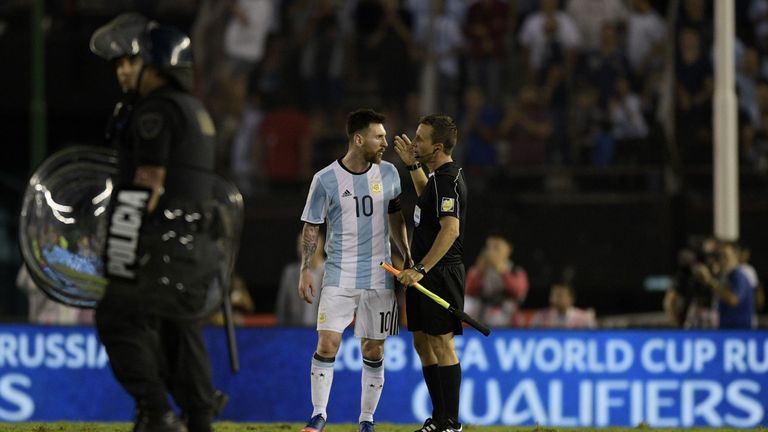 Argentina's Lionel Messi speaks with the linesman during their 2018 FIFA World Cup qualifier football match against Chile 