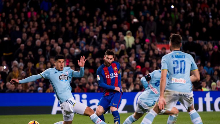 BARCELONA, SPAIN - MARCH 04:  Lionel Messi of FC Barcelona shoots the ball and scores his team's fifth goal 