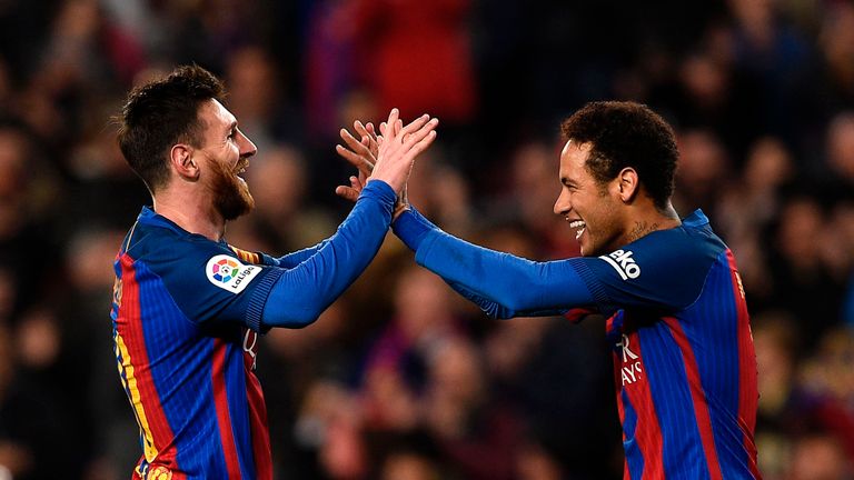 Barcelona's Argentinian forward Lionel Messi (L) celebrates with Barcelona's Brazilian forward Neymar (R) 