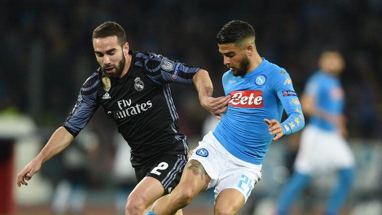 Napoli midfielder Lorenzo Insigne (right) shields the ball from Real Madrid's Dani Carvajal 