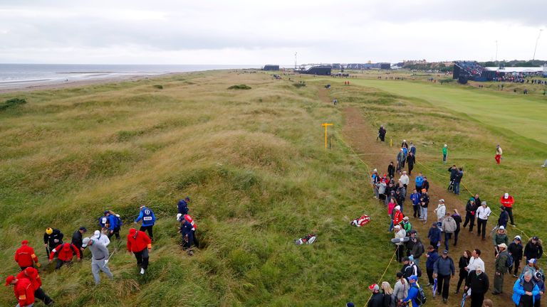 Gary Woodland looks for a lost ball at The Open