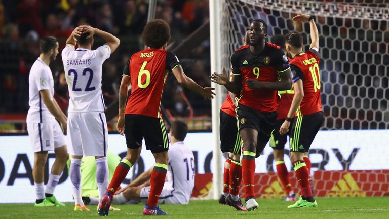 BRUSSELS, BELGIUM - MARCH 25:  Romelu Lukaku of Belgium celebrates scoring his teams first goal of the game with team mates uring the FIFA 2018 World Cup G